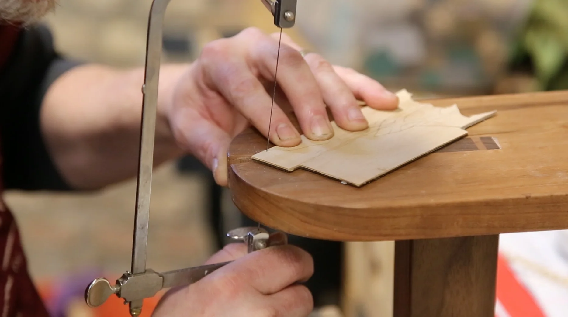 A table, called a donkey, contructed for marquetry. It allows the conservators to cut around decoration penciled in previous to cutting.