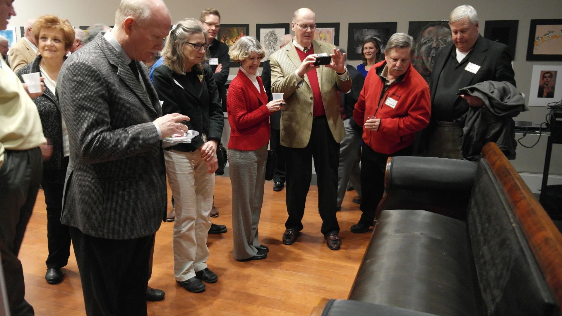 Guests marvel the newly restored Lincoln "Courting Couch"