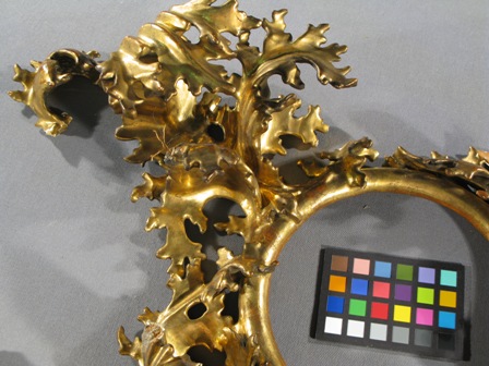 (Above) Detail of lost decorative leaf on the proper right side of the frame