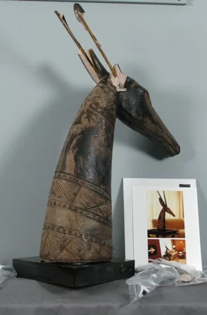 (Above) Pre-treatment: African antelope sculpture