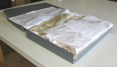 (Above) Example of long term archival materials: an acid-free, corrugated box with acid-free tissue.