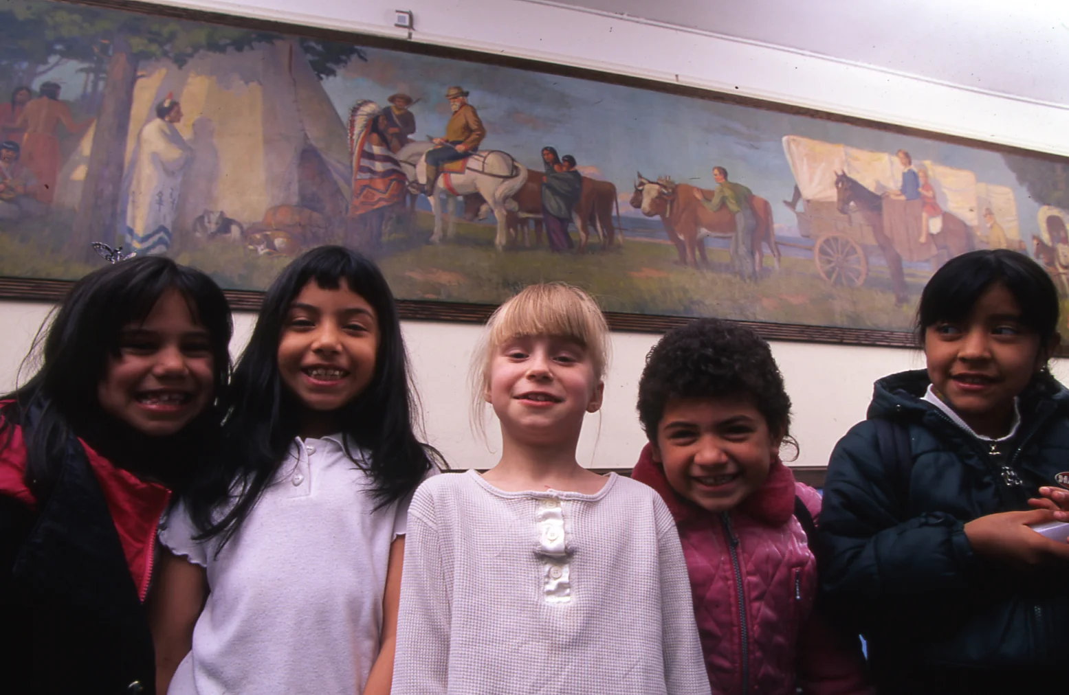 Pioneers and Indians, Datus E. Myers, 1920, oil on canvas, at Linné Elementary School with students.