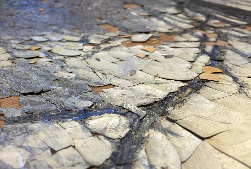 Painting with flaking paint due to climate fluctuations.