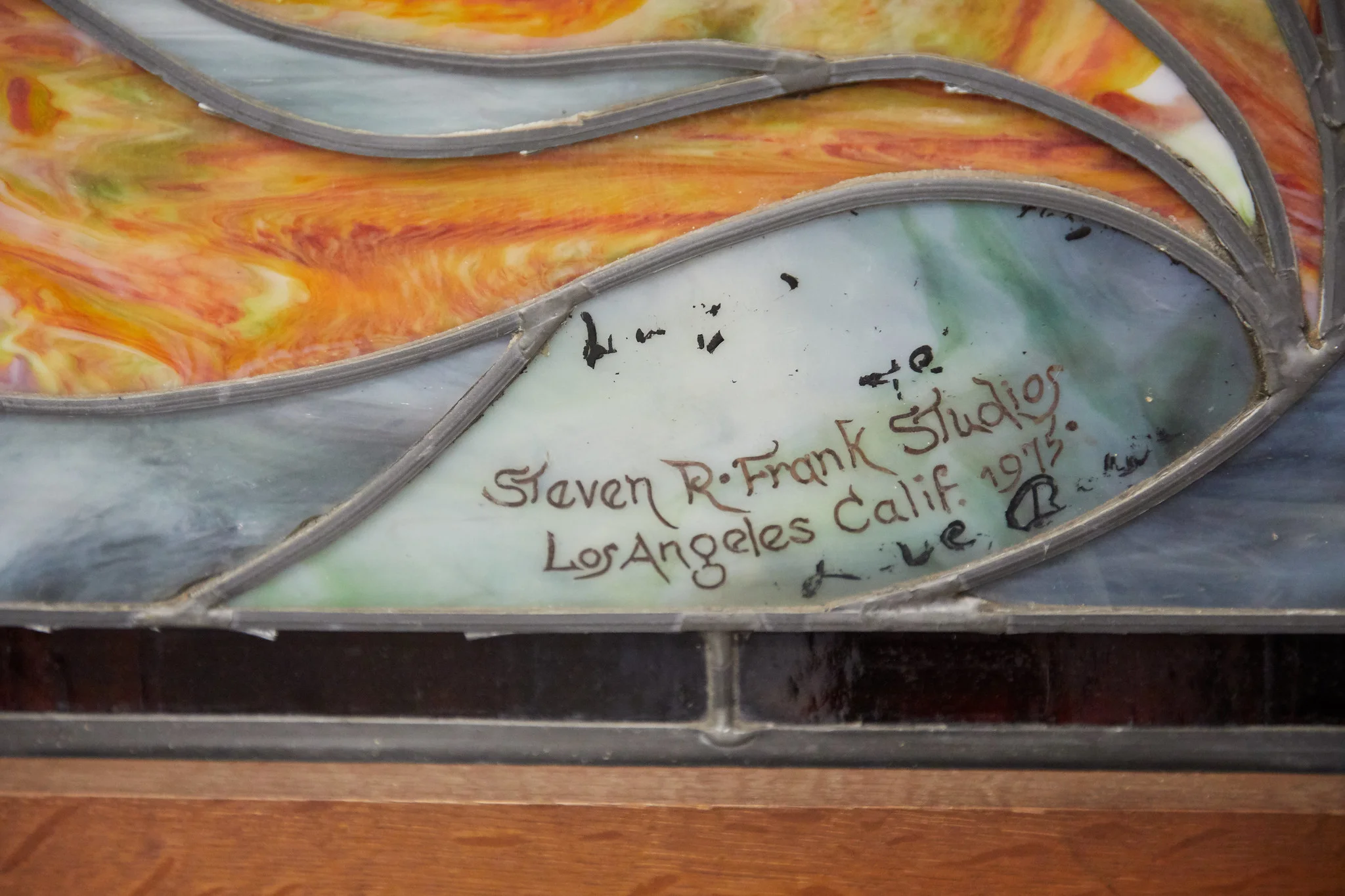 A closeup of the inscription, “Love Barbi” at the bottom.