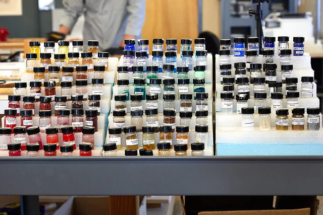 Pigments lined up on the cart in the painting department.