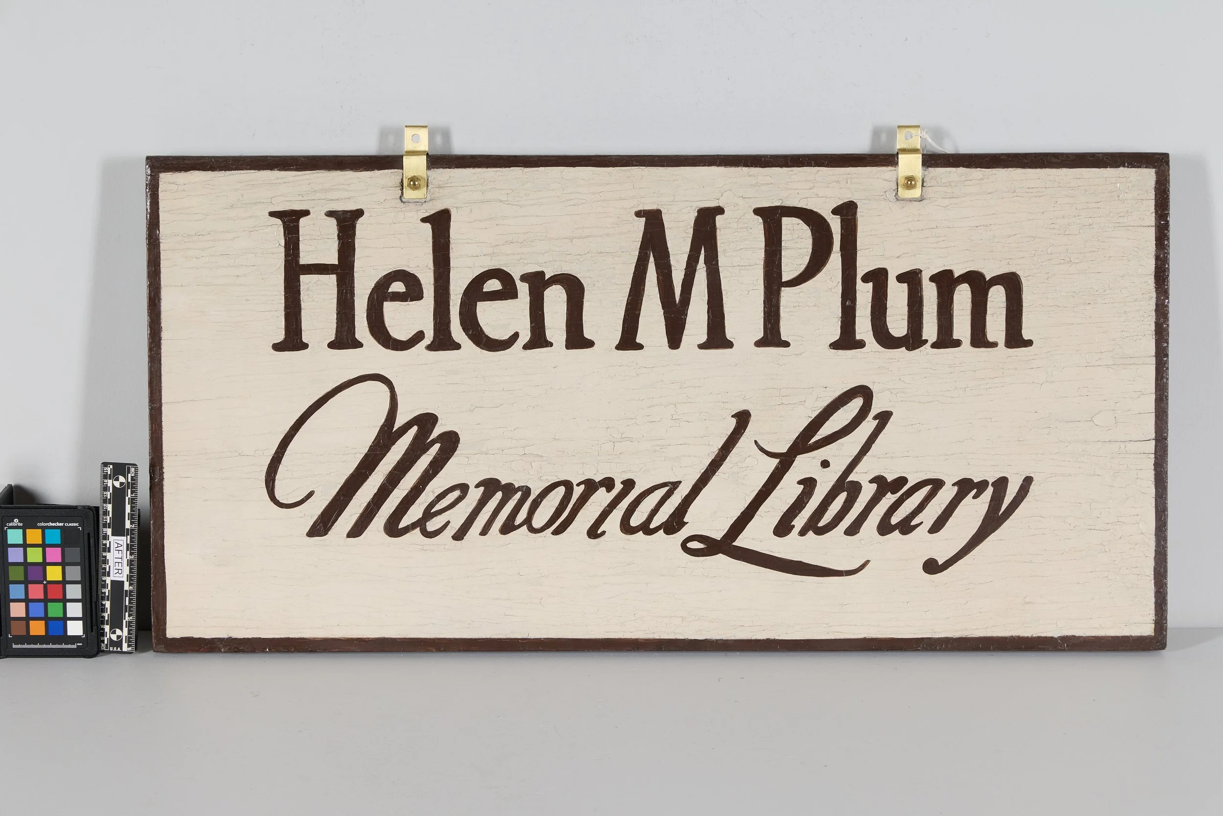 A Sign of the Times: Preserving the Original Helen Plum Library Sign&nbsp;