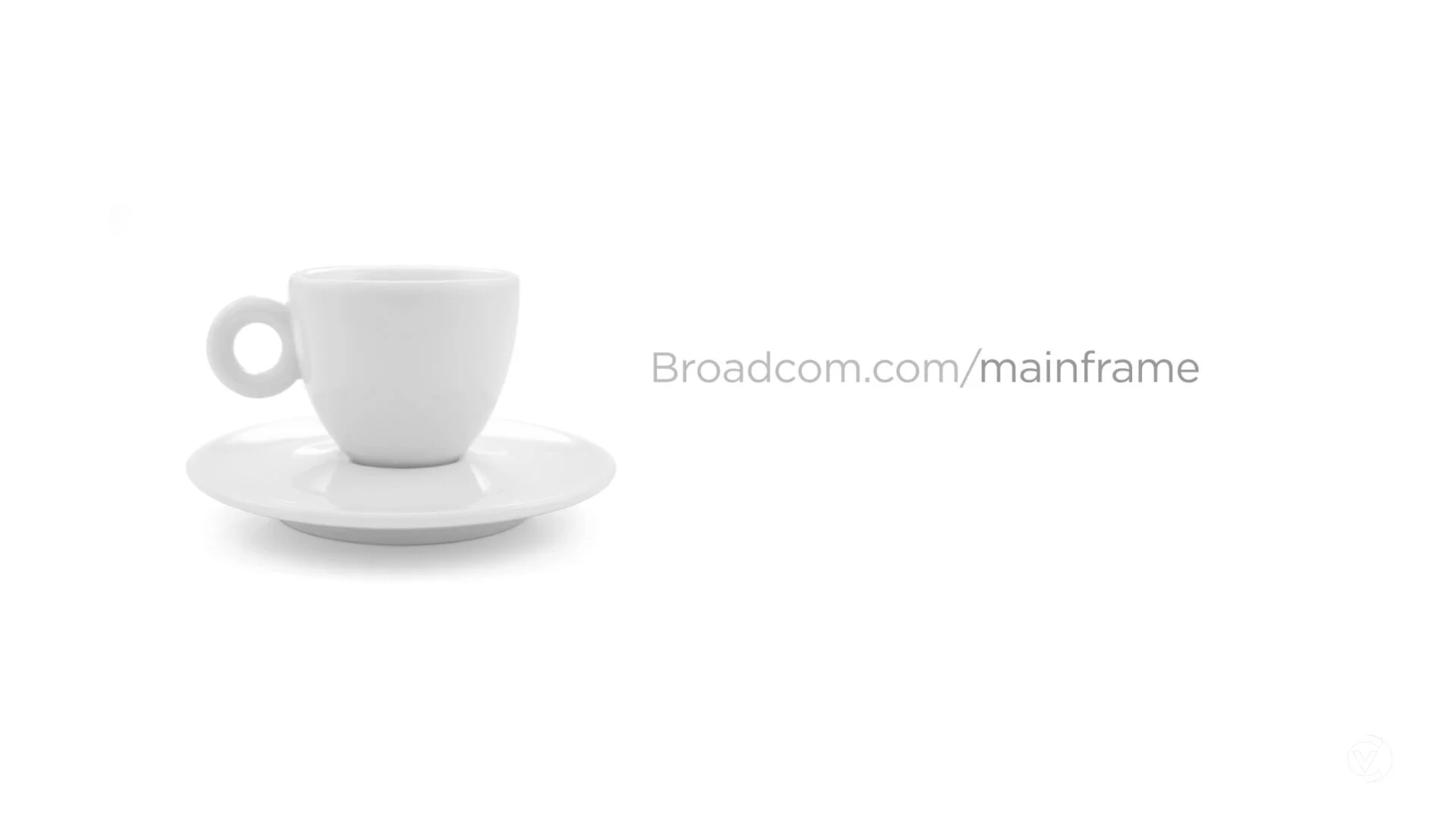 Broadcom mainframe campaign film still, a cup of black coffee beside broadcom.com/mainframe