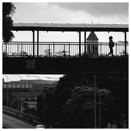 Girl crossing a bridge