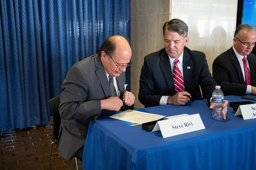 Aldridge CEO Steve Rivi signing the agreement
