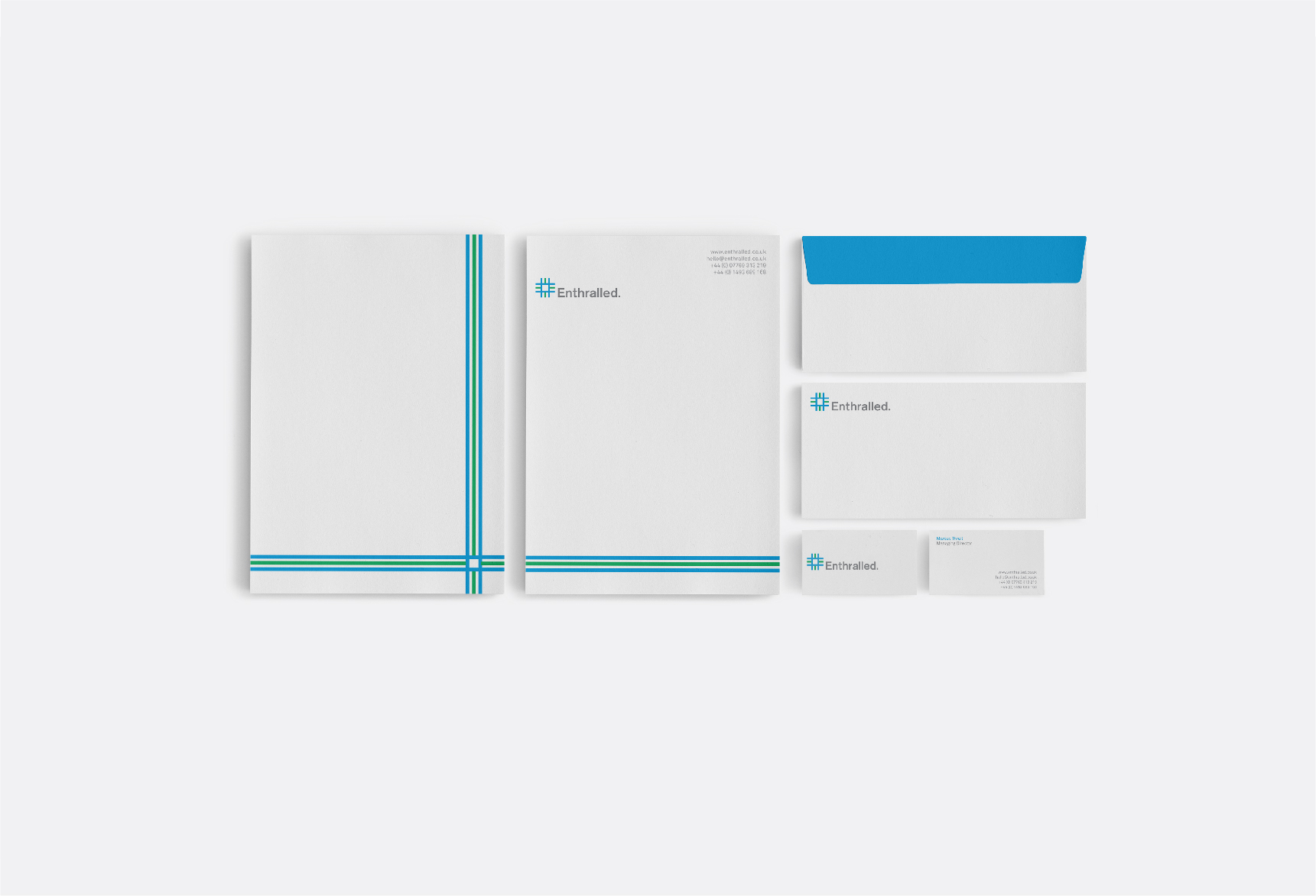 Mix of Enthralled branded white A4 Brand identity designer UK - papers, business cards and envelopes