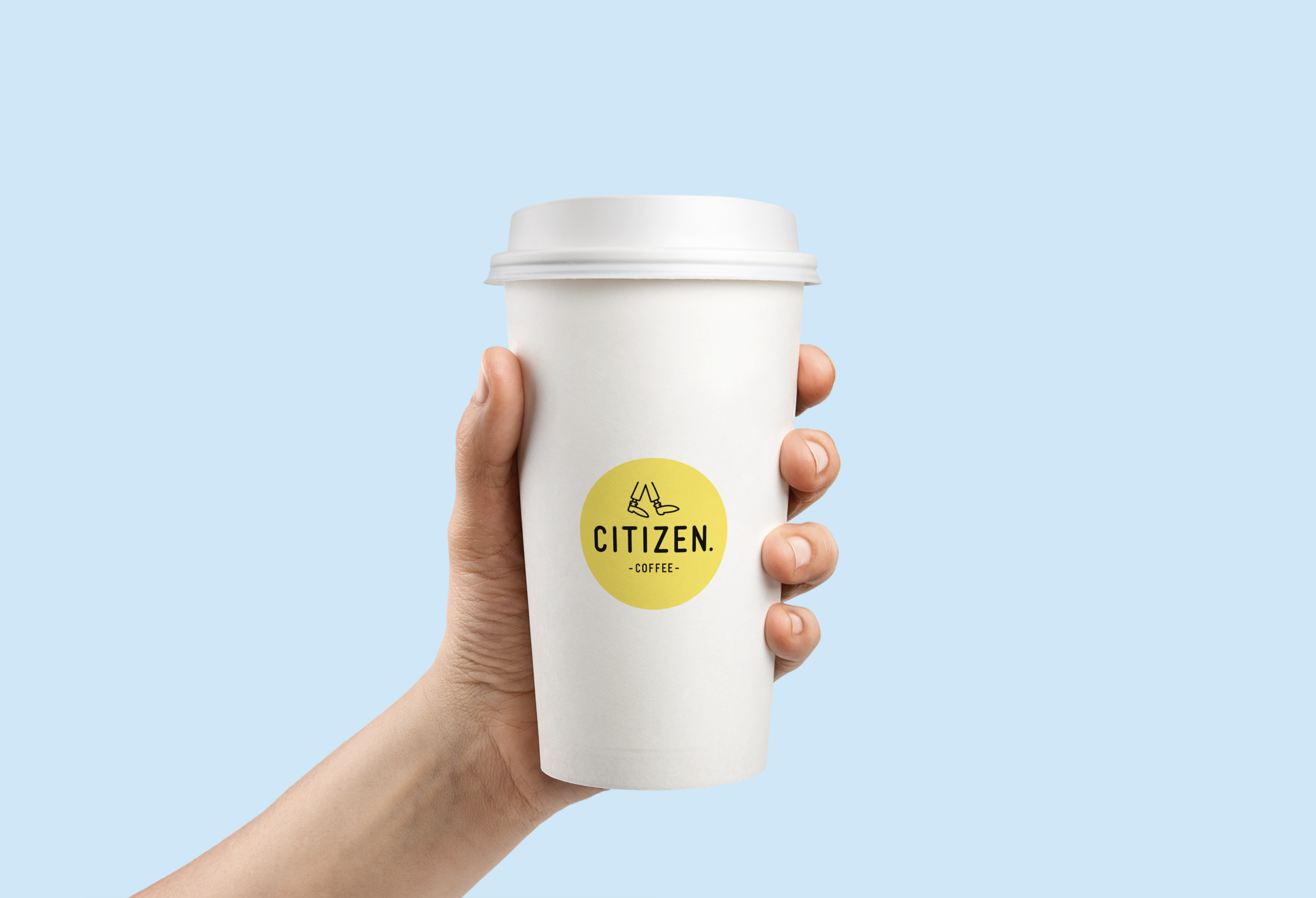 Freelance-graphic-designer-A hand holding a Citizen Coffee logo plastic coffee cup