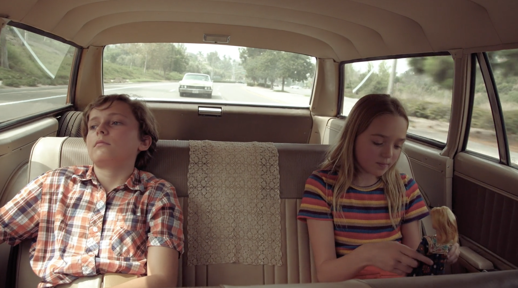 Kids in back seat.png