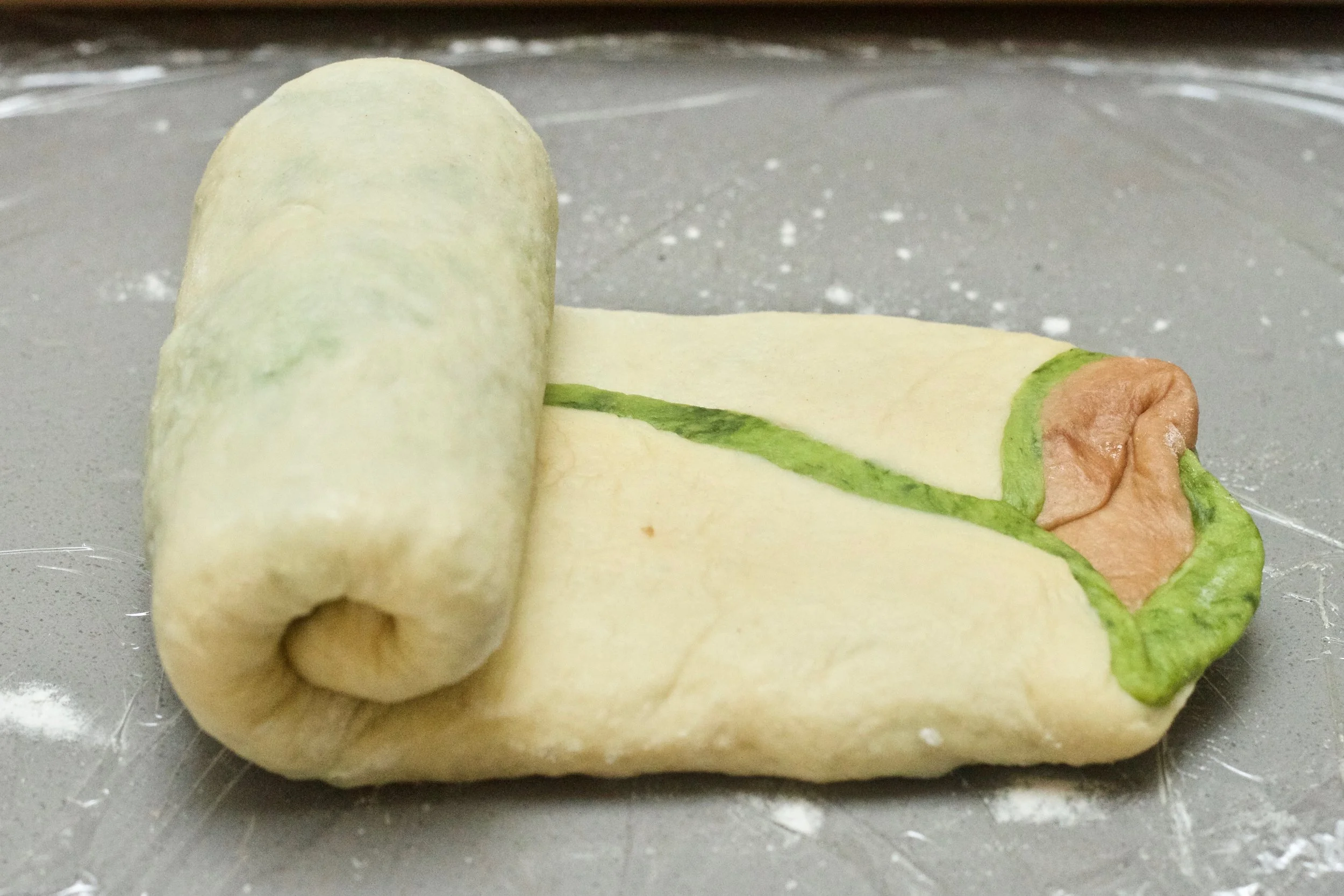 Roll the dough up like you would a swiss roll