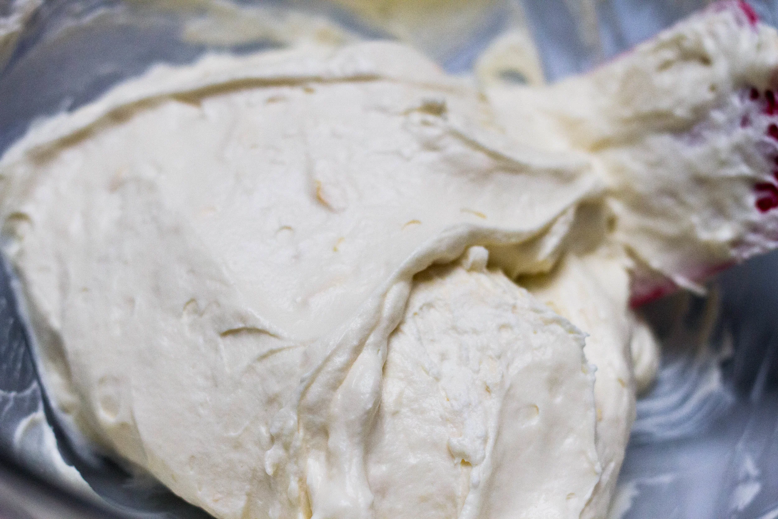 Folding whipped cream into the cream cheese mixture