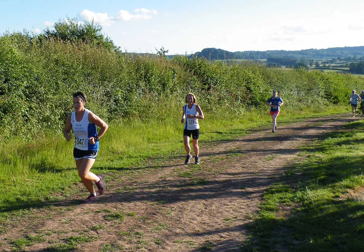ABBEYDORE WEDNESDAY 27th June 2018 Wye Valley Runners look forward to welcoming everyone back to Abbeydore. The course is best described as "not flat". Race starts 7.30 prompt. Plenty of parking - with a short walk to start so please arrive in plenty of time. Directions here : https://goo.gl/lBpsnI Postcode for Sat Nav HR2 0JQ A465 from Hereford to Abergavenny Turn right opposite Wormbridge church, signposted Abbeydore Continue and straight over crossroads to a T junction and then follow arrows from there