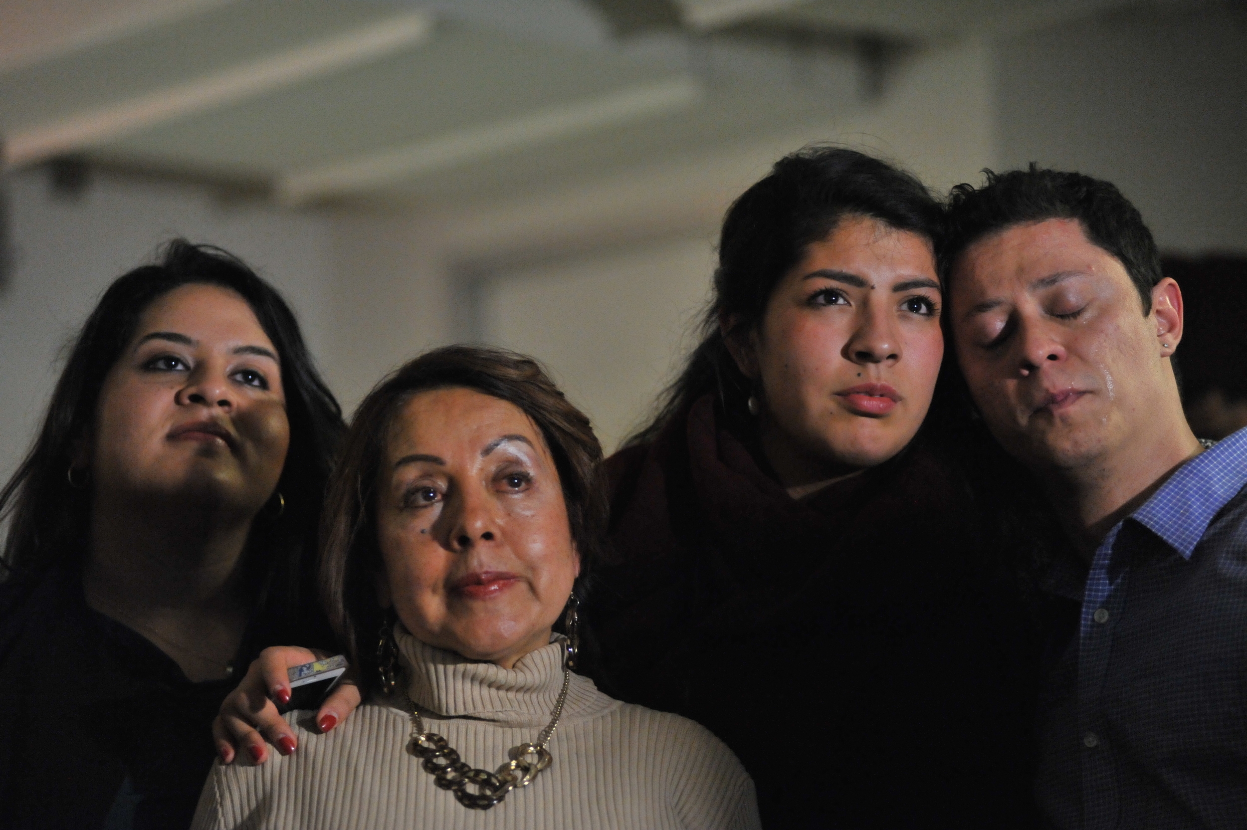  From L to R) Lorella, Chela, Maria Praeli, and Felipe Soussa Rodriguez become emotional while others share their experience on how Obama's decision to protect up to 5 million immigrants did not qualify to them during a watch party at United We Dream