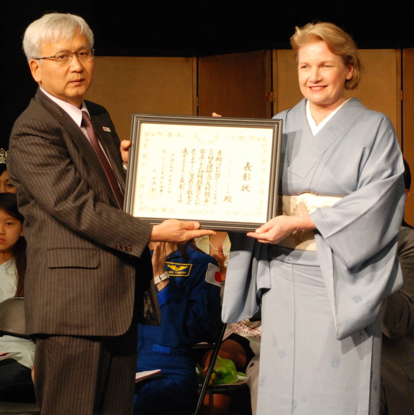In 2012, Consul General Kiyokazu Ota, Consulate General of Japan in Seattle, presented Ms. Mitchell the Commemorative Award for her work in promotingunderstanding and appreciation of Japanese culture among the broader American community.