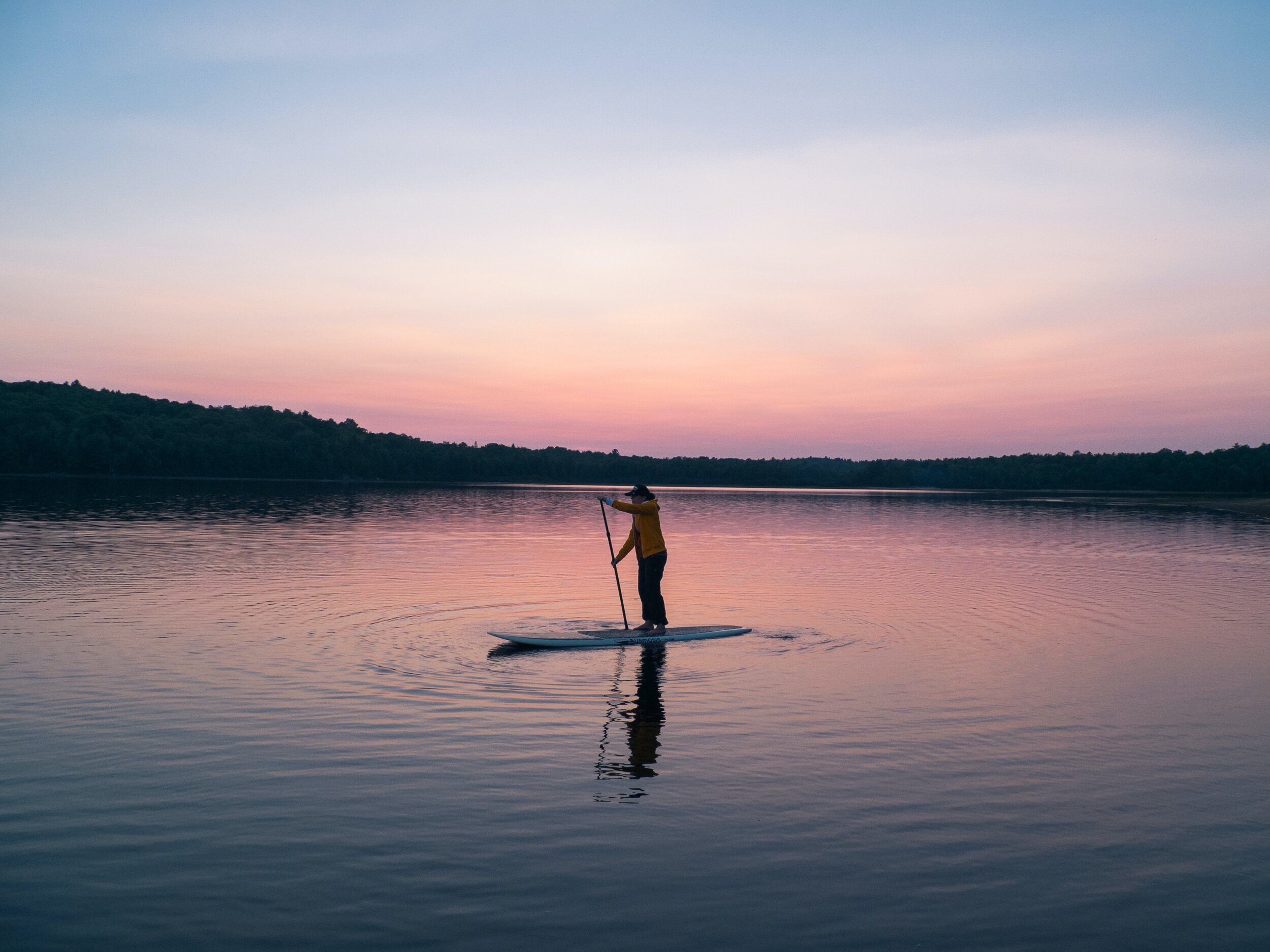 man-riding-board-on-middle-of-body-of-water-1790184.jpg