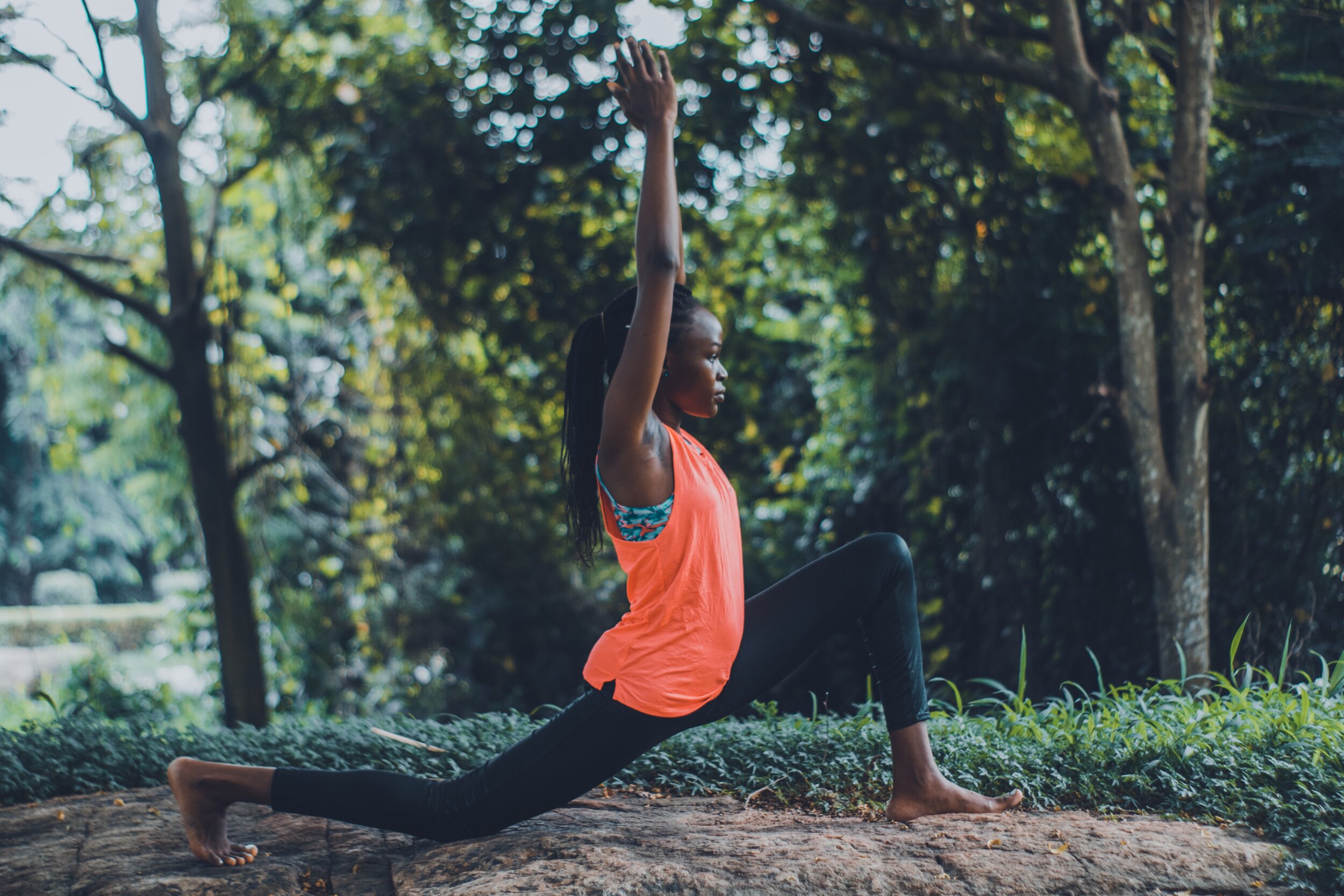 photo-of-woman-in-orange-tank-top-and-black-pants-striking-a-3658399.jpg