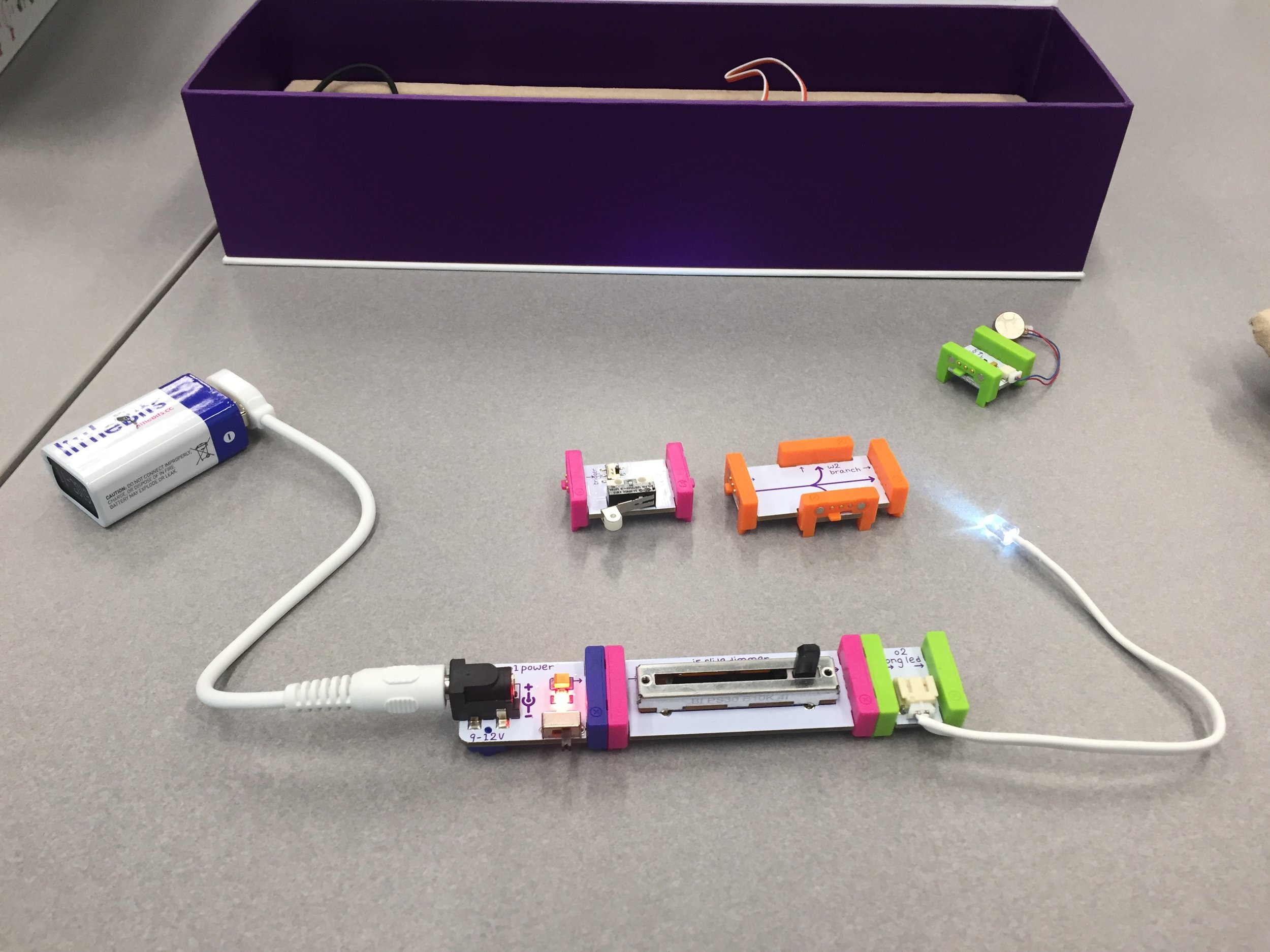 Little Bits in action (blue is the power, pink the input, and green the output).
