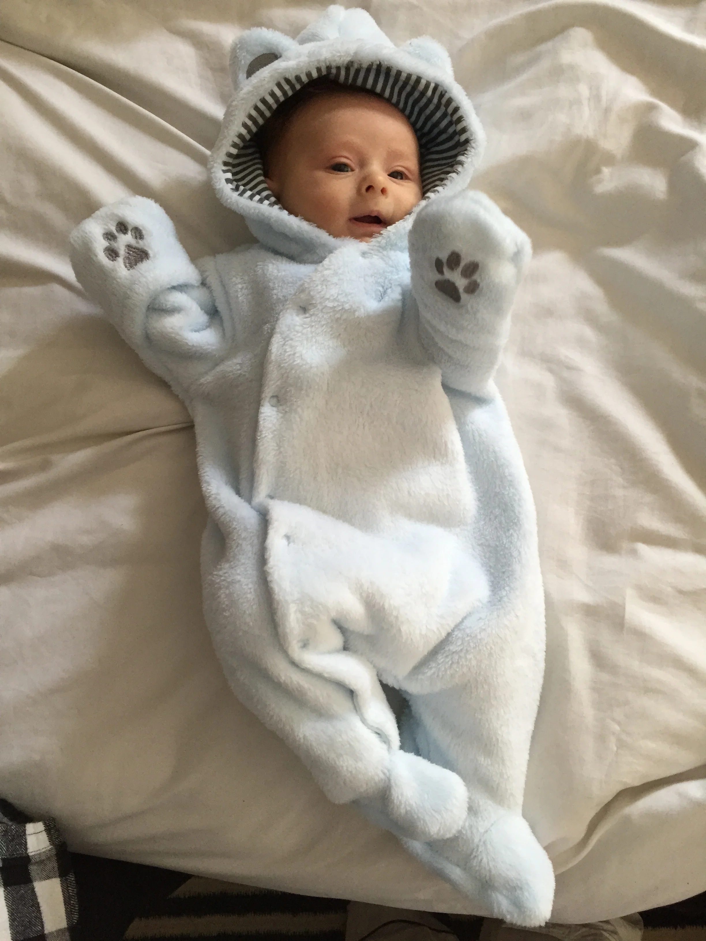 Showing off his new bear onsie