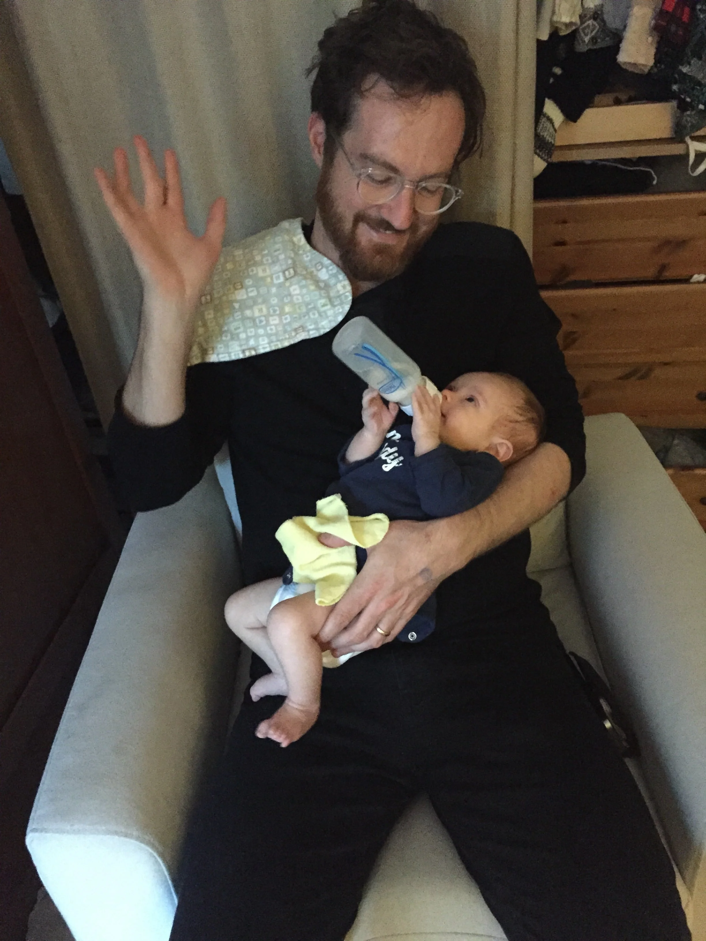 Nico likes to hold his bottle and can sometimes keep it up without Daddy's help
