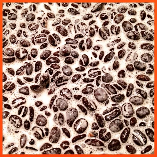 Coffee beans soaking in heavy cream