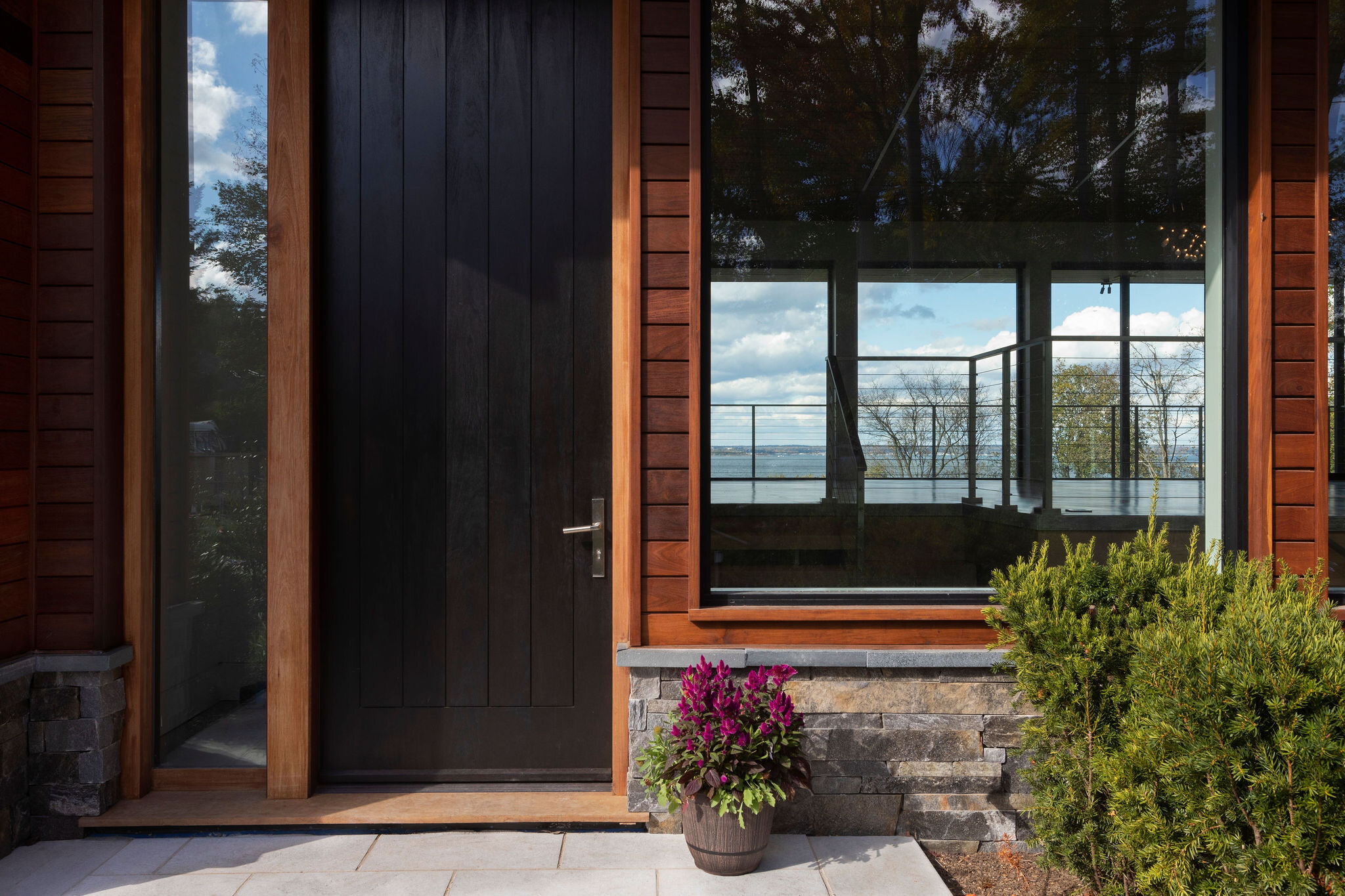  The new huge front door is stained a dark blackened brown color , giving a sense of excitement to what lays ahead… 