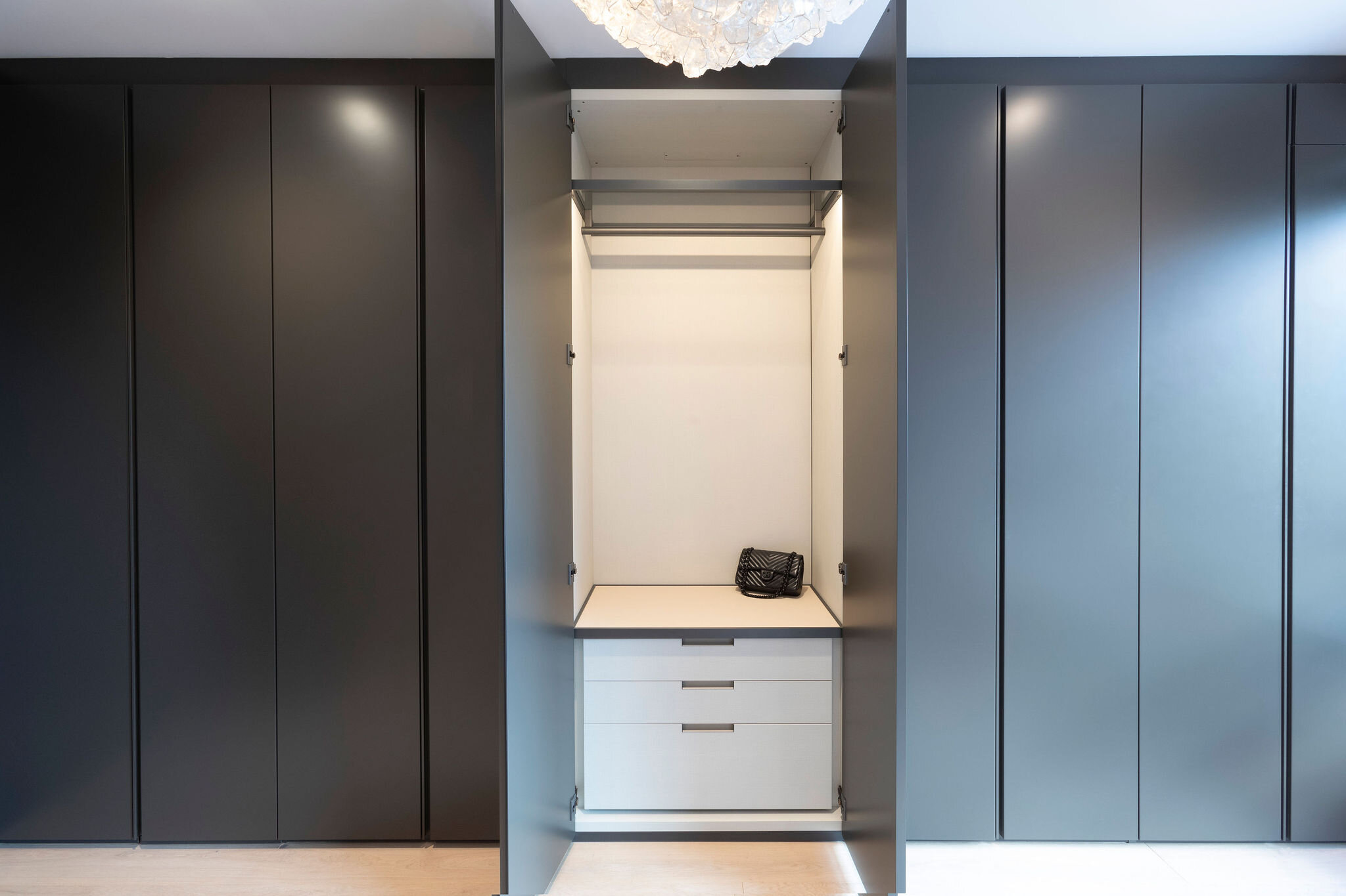  Each closet opens up to lit leather interiors. 