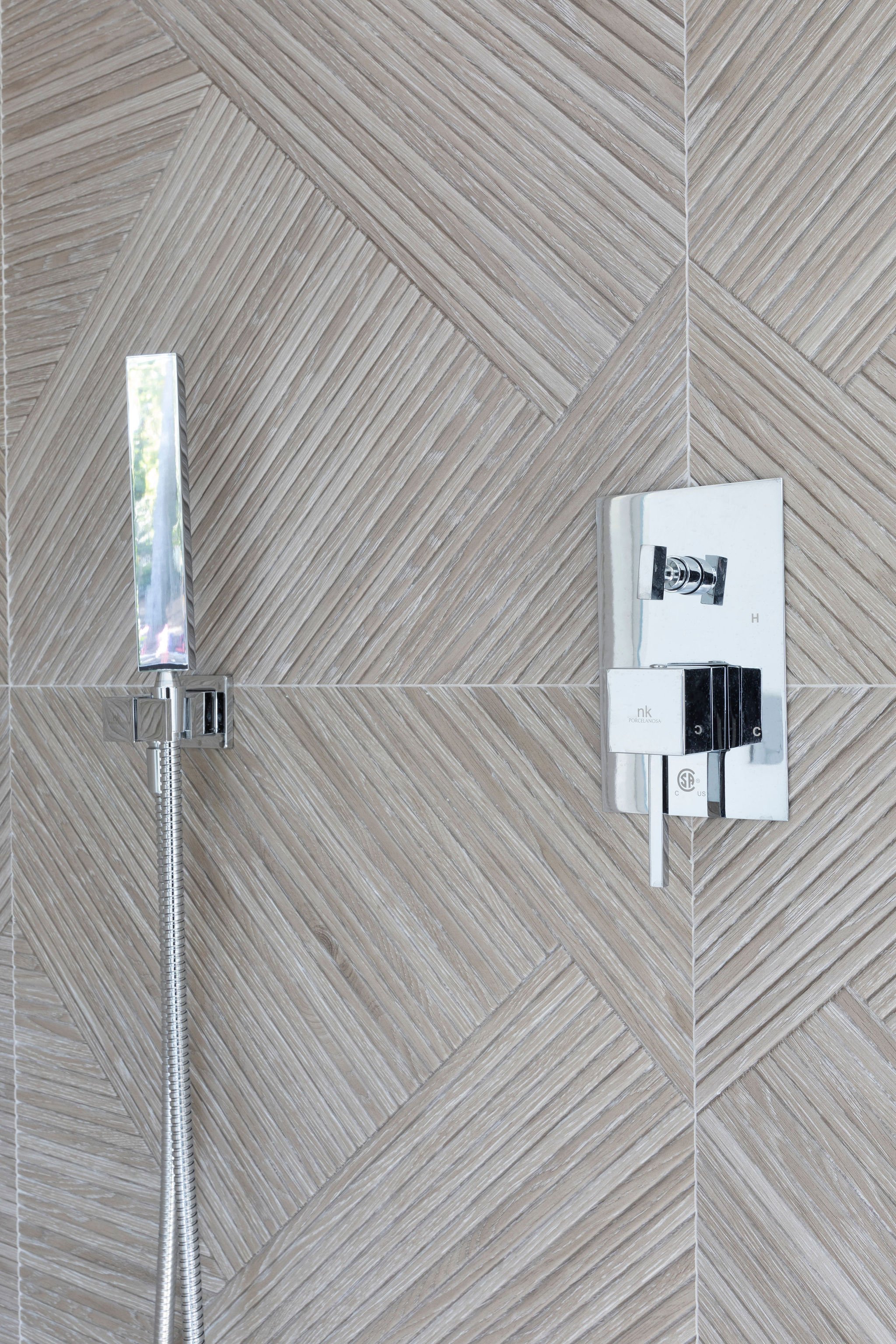  Textured geometric tile surround this guest shower. 