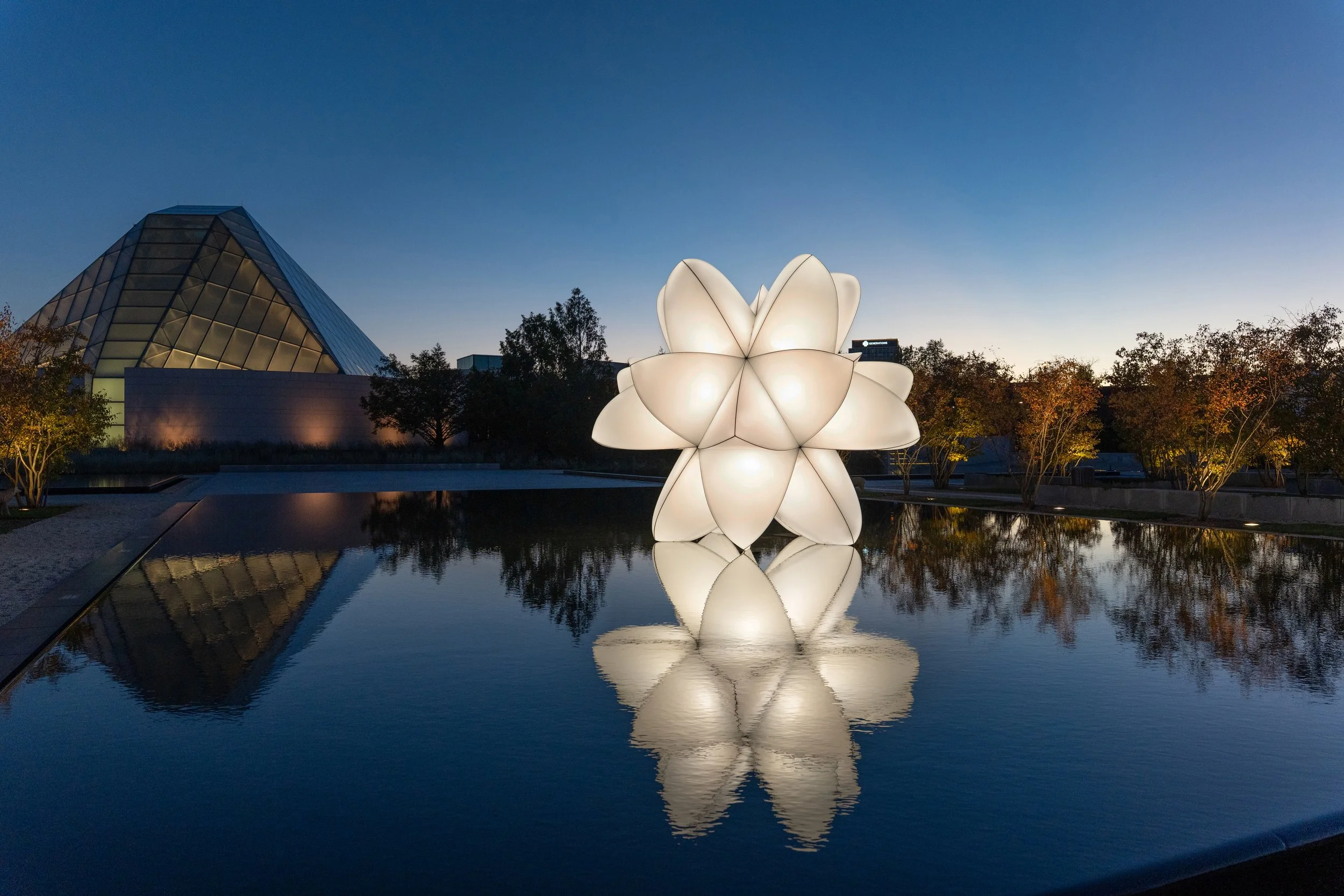 Night Time view of "materia prima" by JAH Qube shot in front of the Ismaili Center, whose internal illumination is an inspiration for creating a tent fabric sculpture. Photo by Michael Nguyen