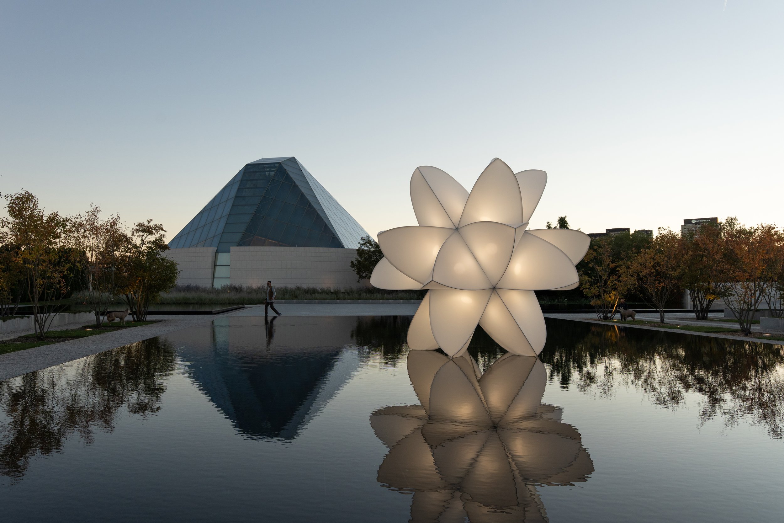Dusk view of the floating sculpture "materia prima" on the central pool of Aga Khan Park. Photo by Michael Nguyen.