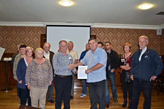 John Gildea (left) MBC Builders shaking hands with James Quigley (right) Inishowen group