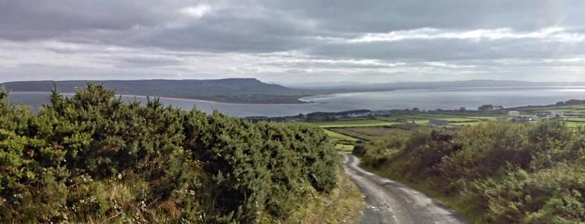 View of Greencastle and Lough Foyle with Magiligan Head in background