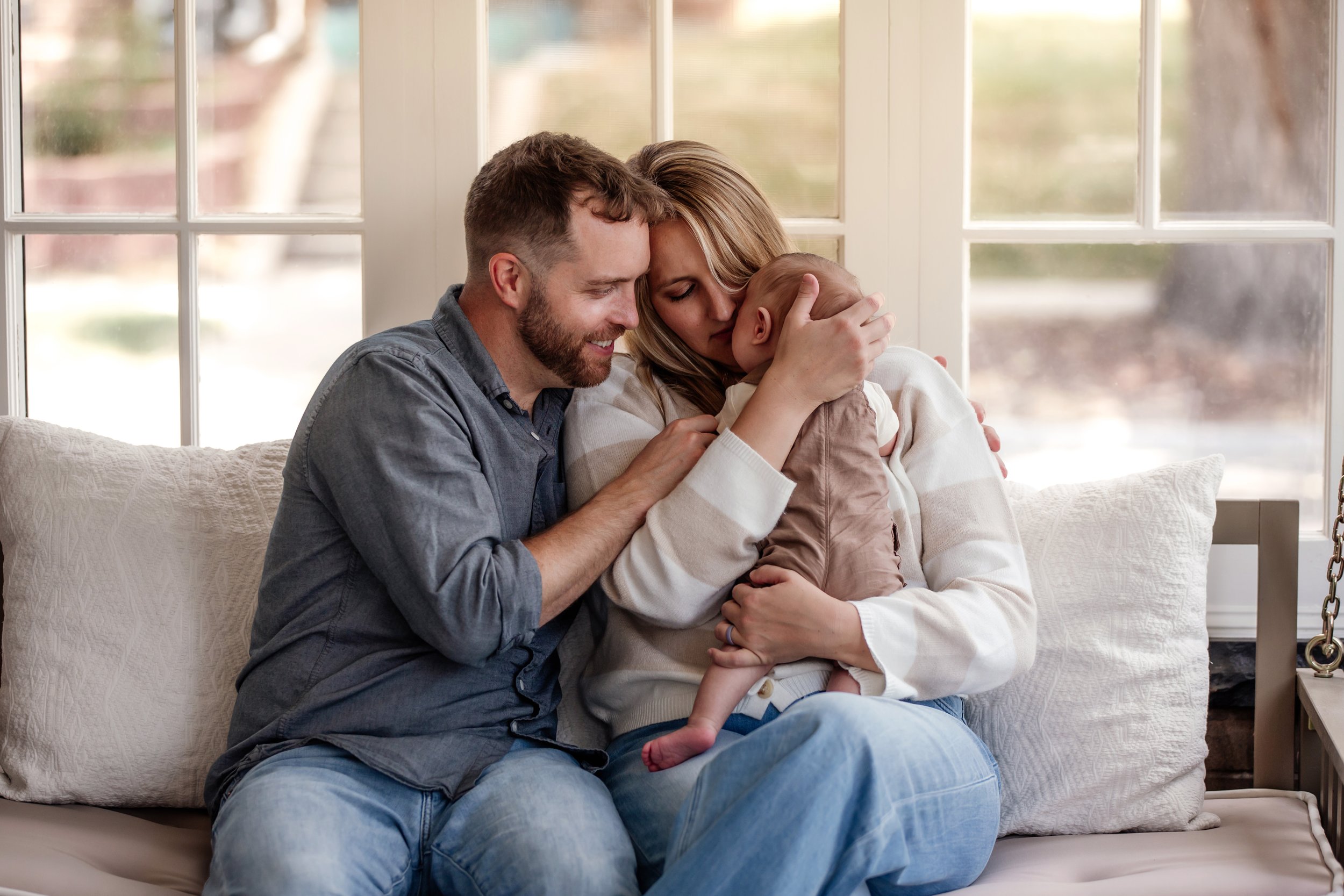 denver family newborn lifestyle session on porch with dog and baby