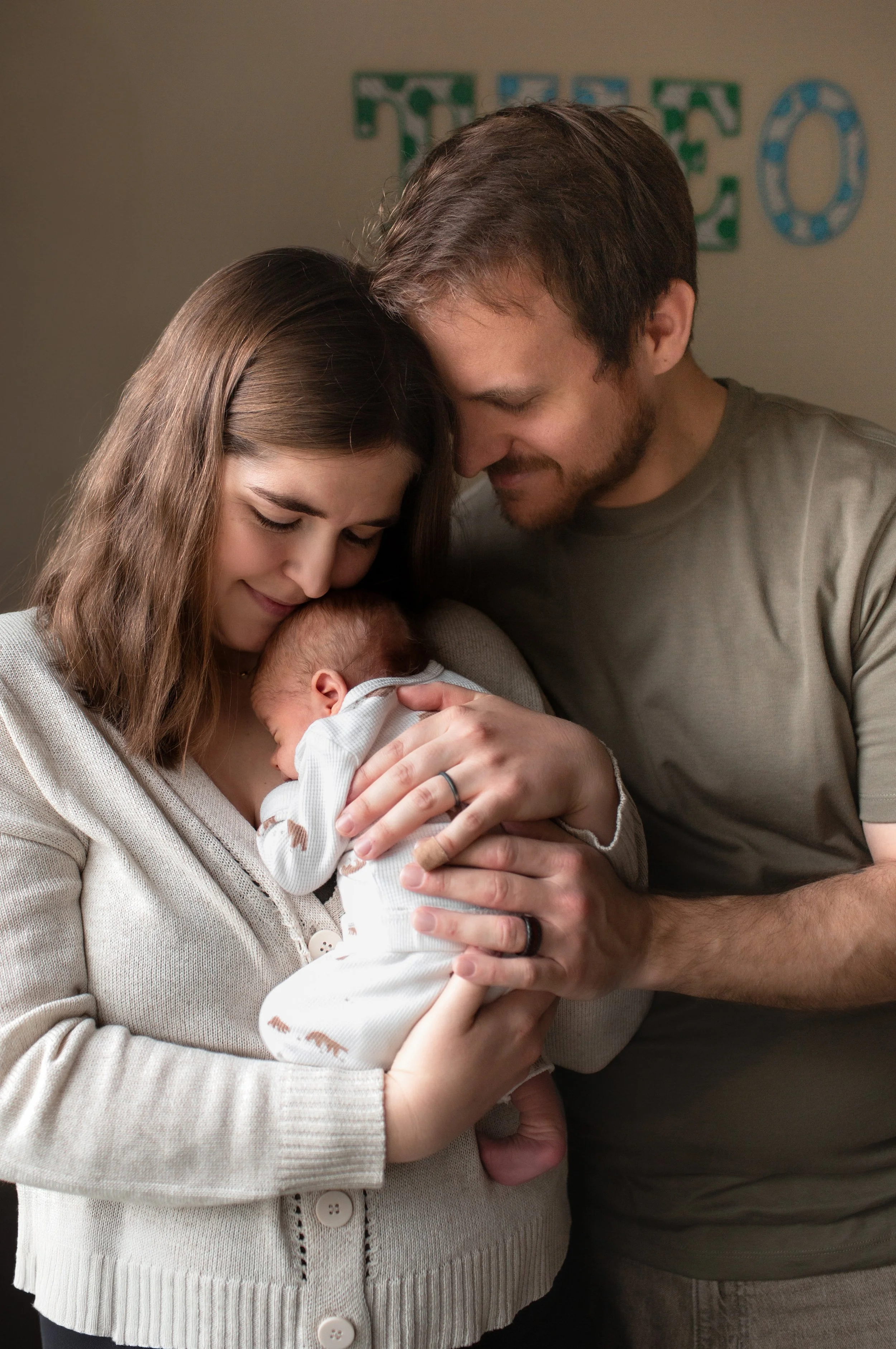 Denver Newborn Lifestyle photos in home with infant and parents