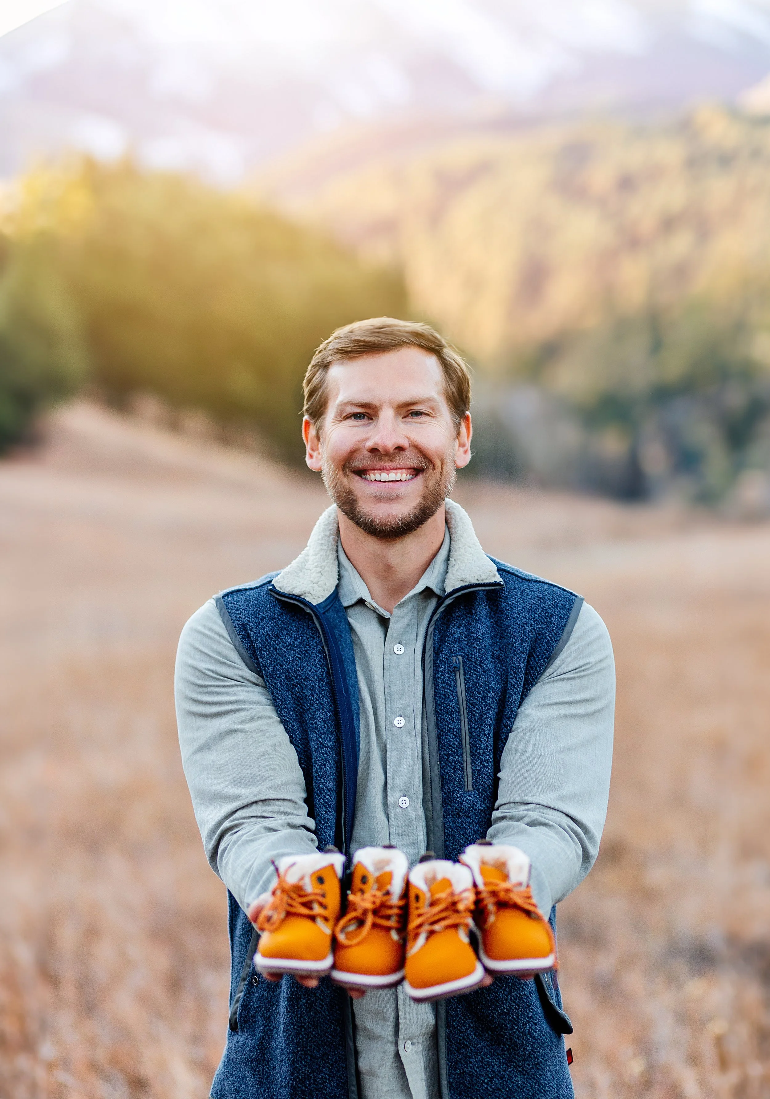 Dad during photo session holding cute baby photos