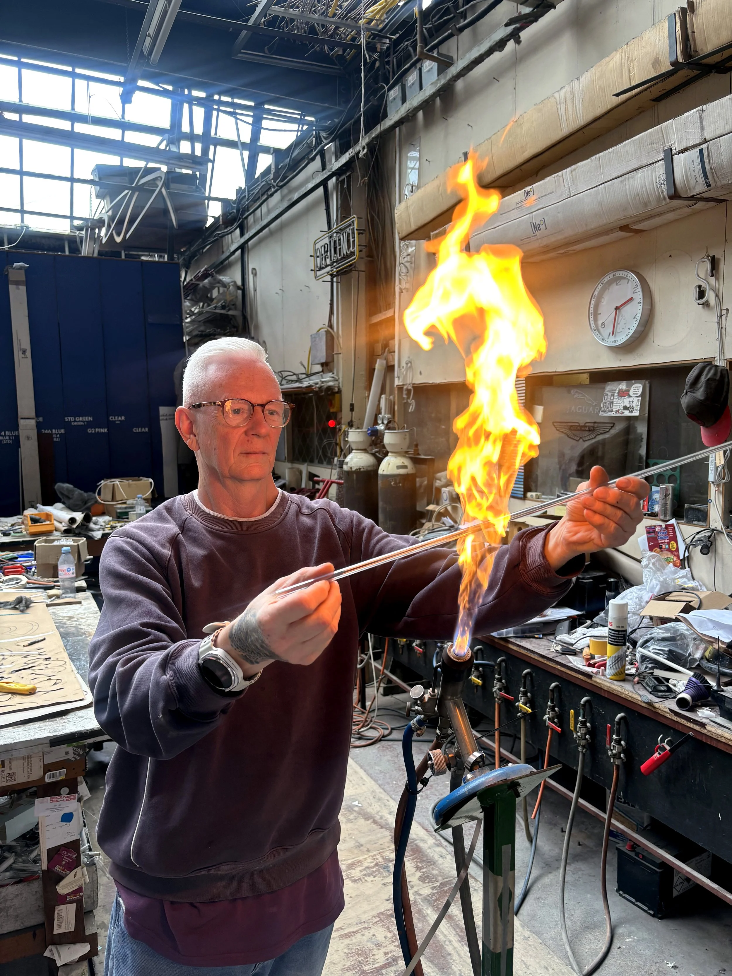 Master craftsman behind Louis Sidoli neon art.