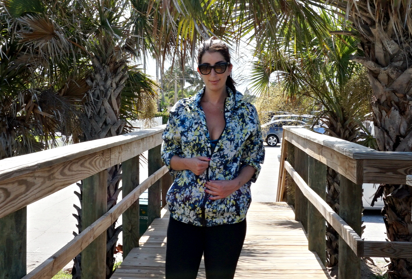 Rain Jacket, courtesy of FatFace. Leggings, Courtesy of Marshalls. Sunglasses, Prada. Shot on location in Florida.