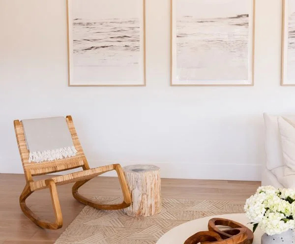 Room with rocking chair and artwork