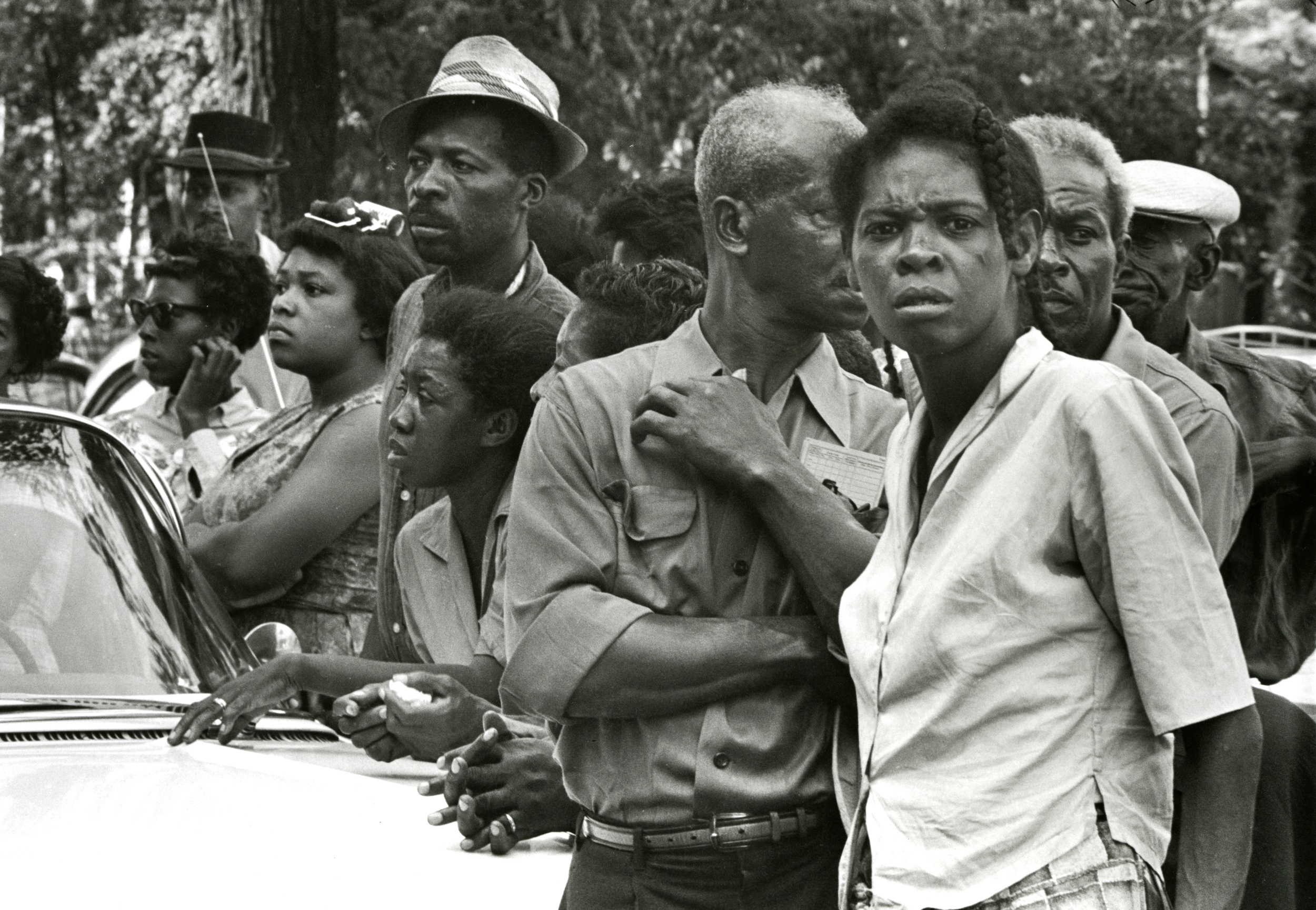 Funeral crowds wait along the road, Birmingham, AL, 1963