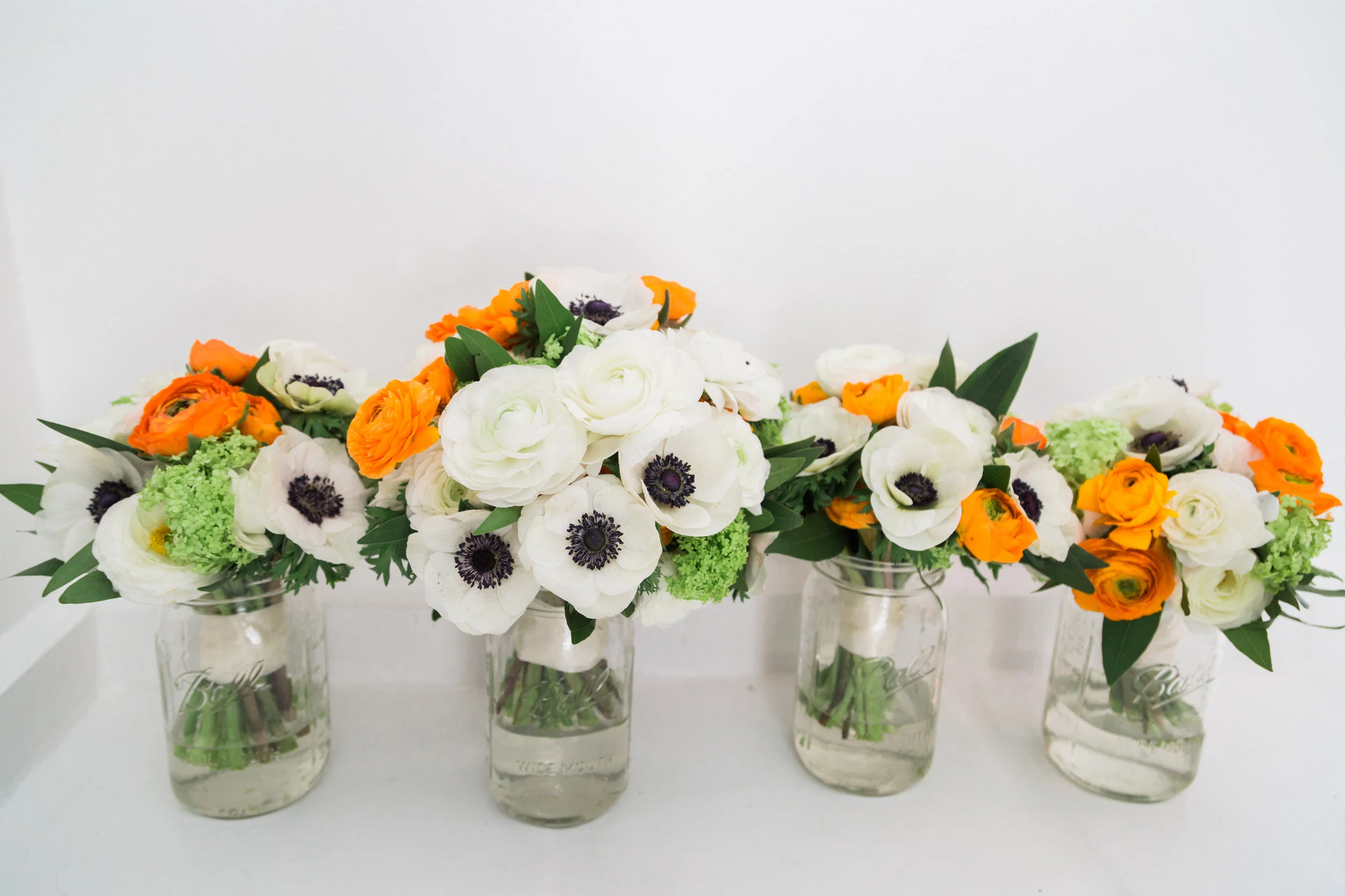 Orange and white bouquets.jpg