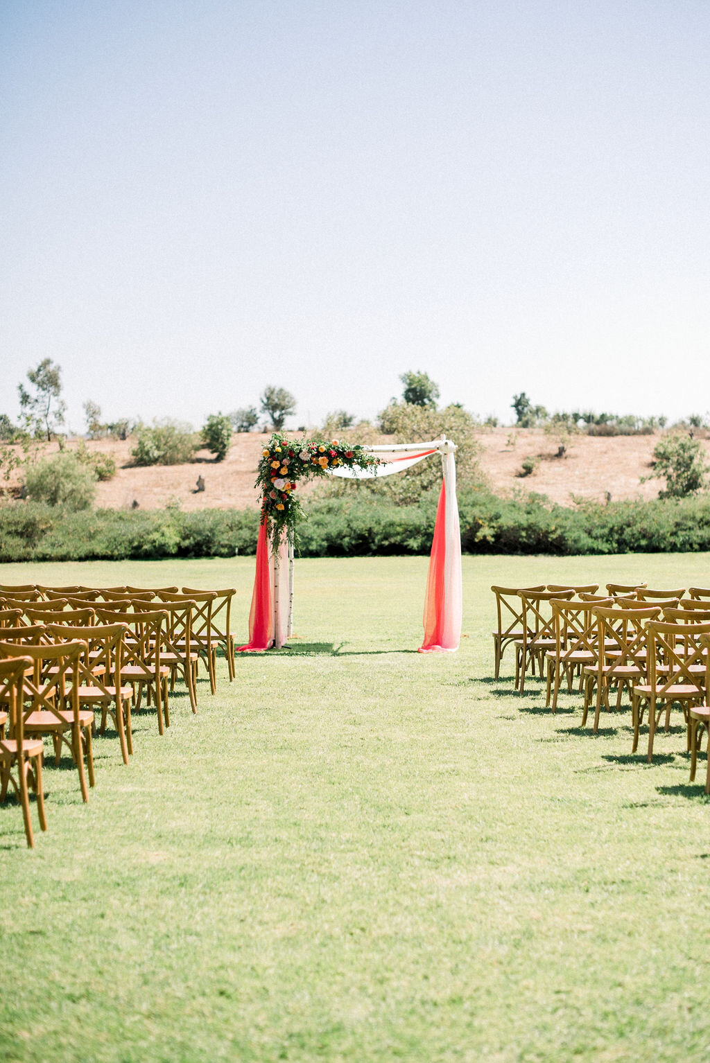 colorful ceremony arch flowers.jpg