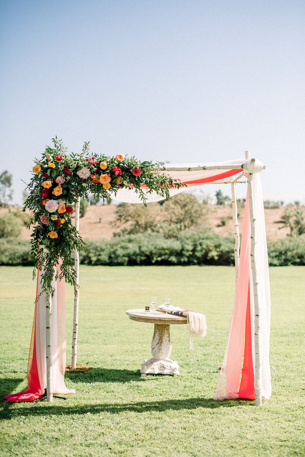 colorful wedding arch flowers.jpg