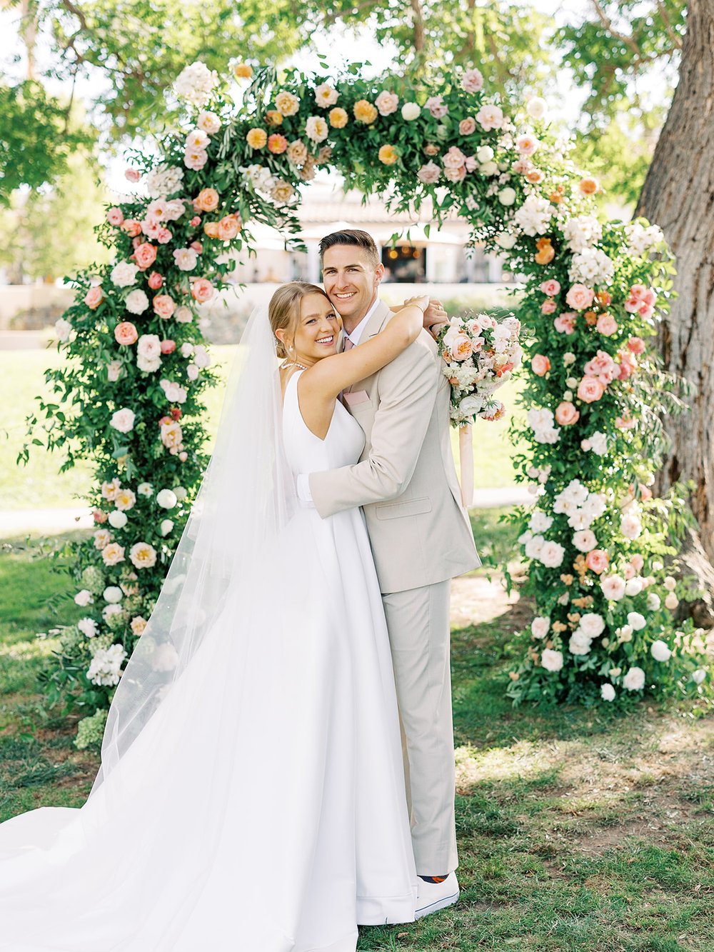 colorful wedding arch flowers.jpg
