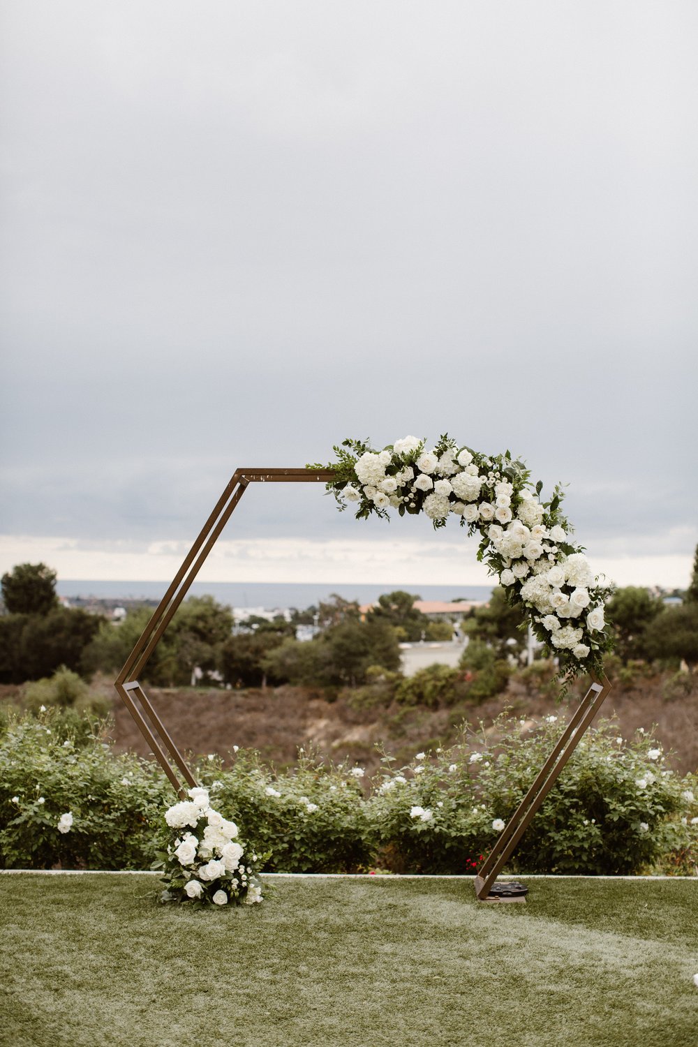 White Wedding Arch Flowers.jpg