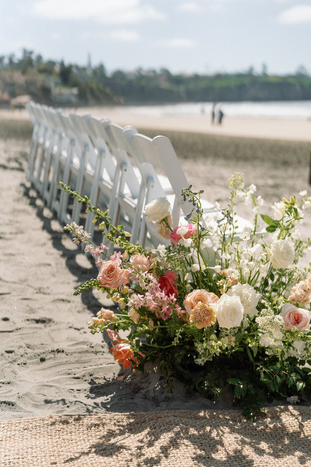 coral pink white aisle flowers.jpg