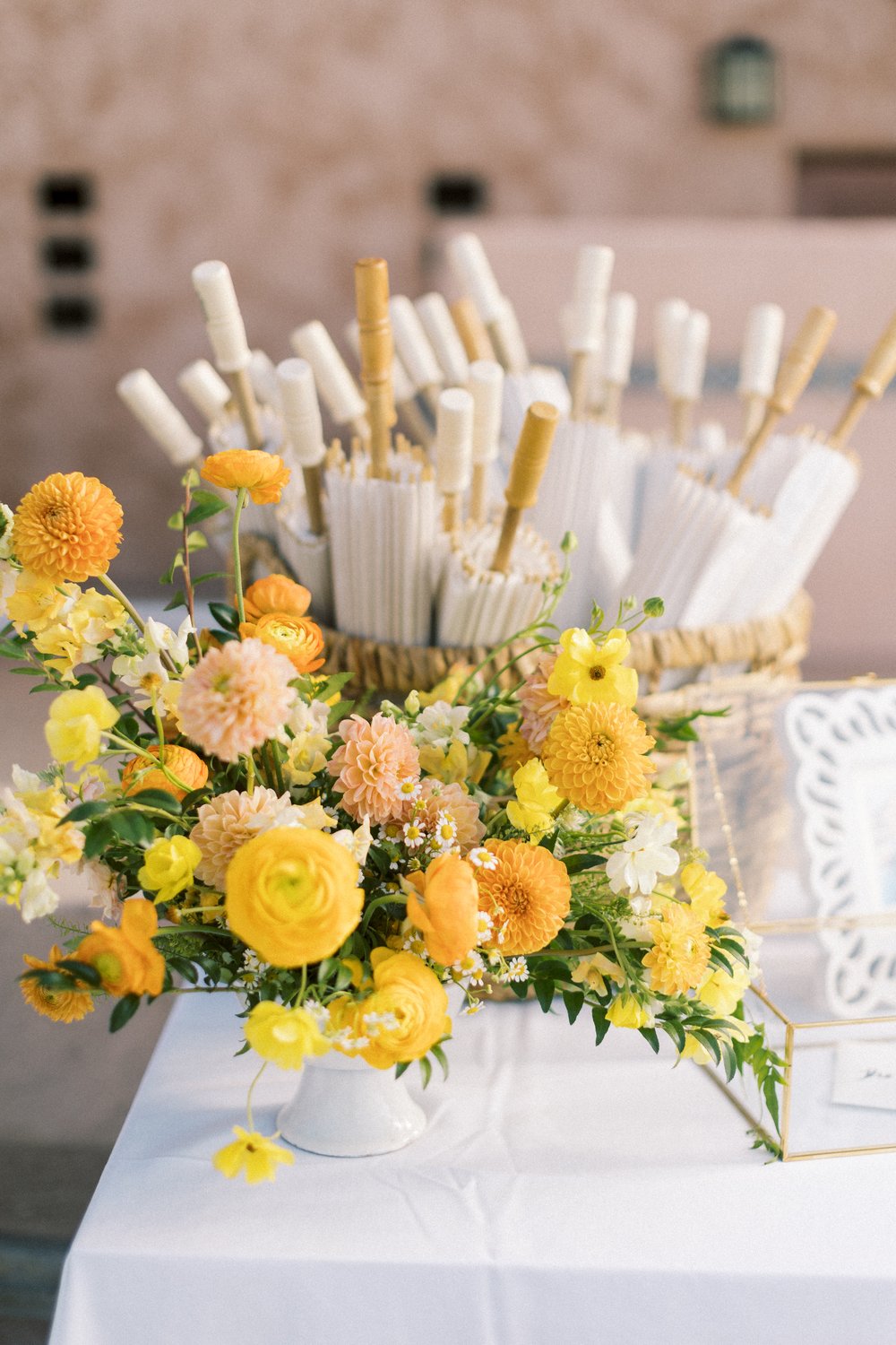 yellow and peach whimsical floral arrangement.jpg