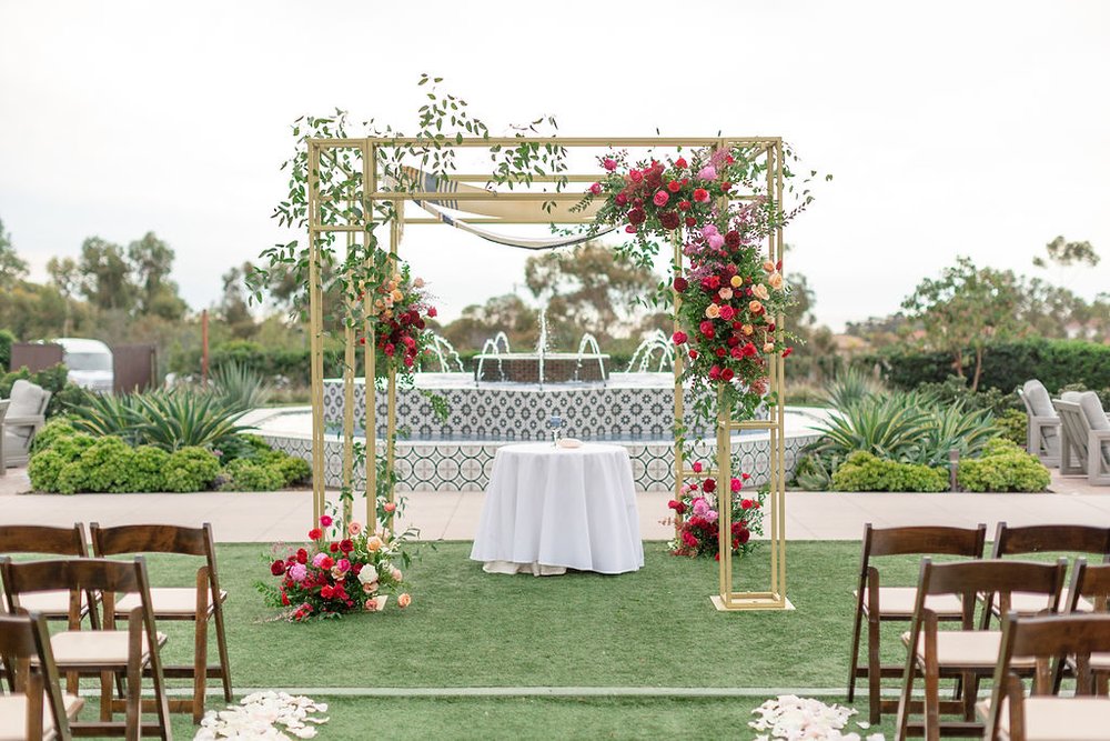 enticing tables arch flowers.jpg