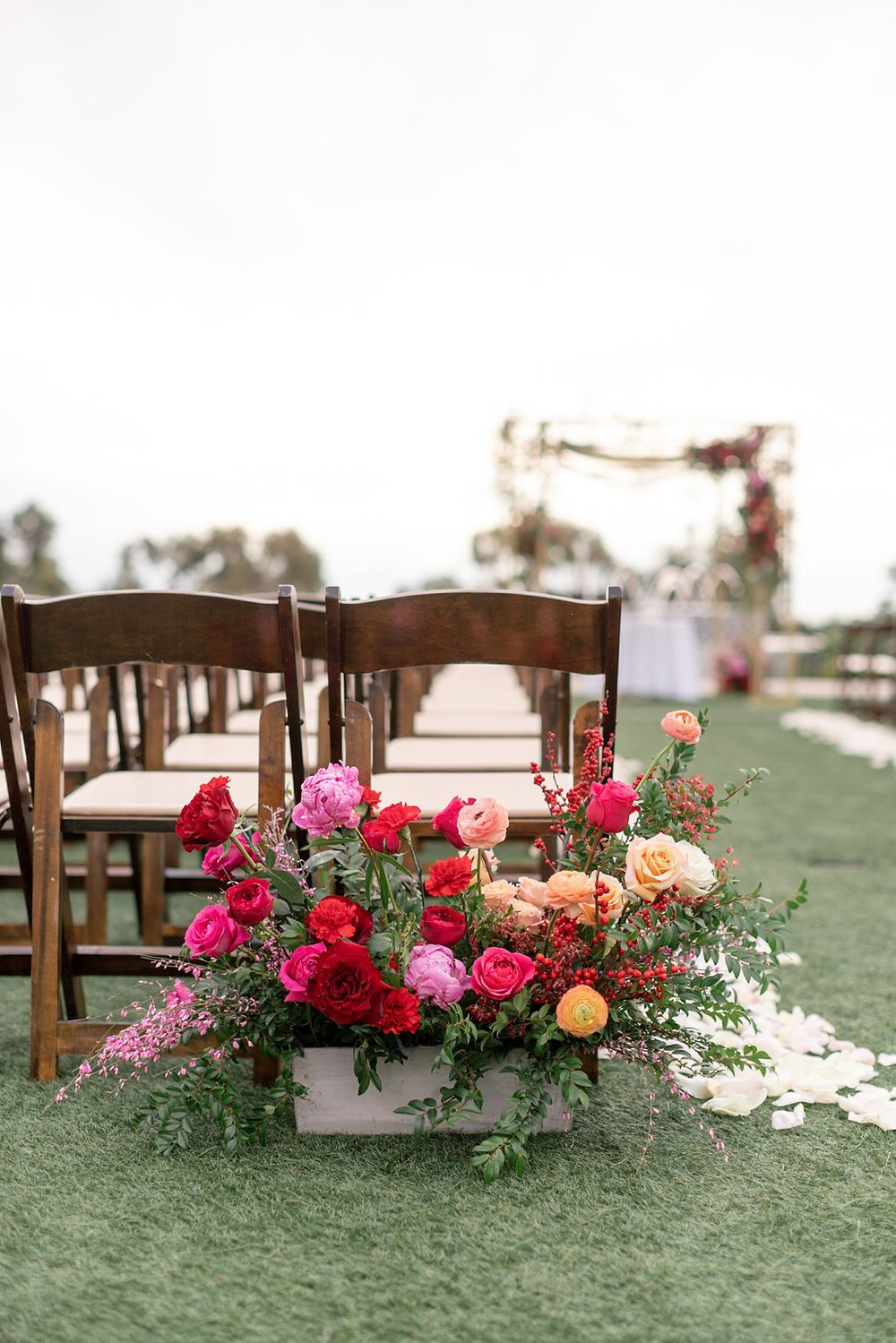 red and fuchsia aisle flowers.jpg